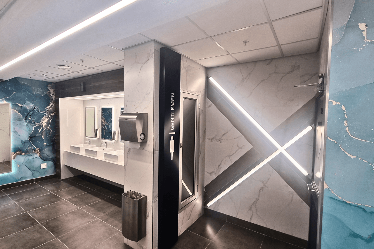 A bathroom featuring elegant blue and white marble walls, creating a sophisticated and modern atmosphere.
