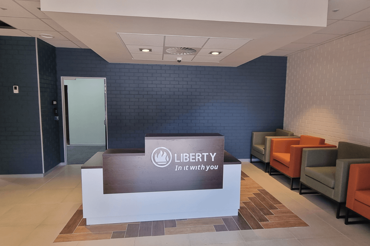 Liberty Life walk-in help center reception, with a service desk and resources for visitors seeking assistance.