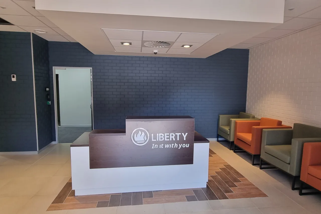 Liberty Life walk-in help center reception, with a service desk and resources for visitors seeking assistance.